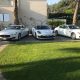 foto con al centro l'ultimo modello della Porsche Panamera e ai lati le Maserati Quattroporte.